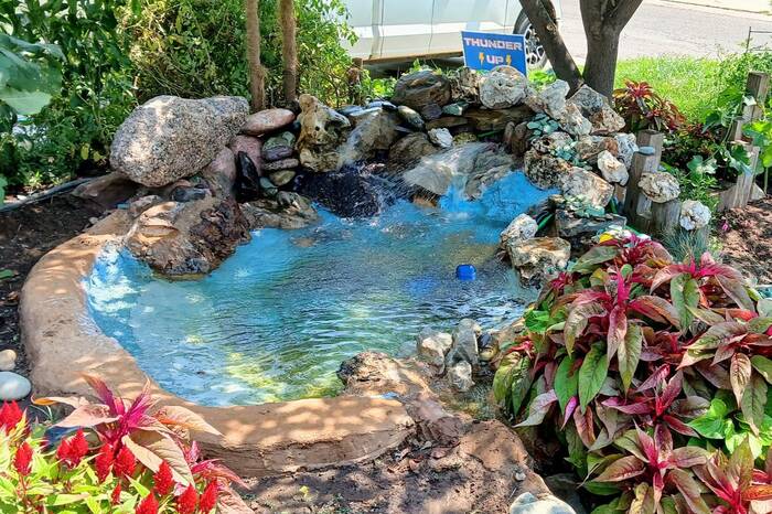 Custom backyard pond and waterfall water feature built in Oklahoma City